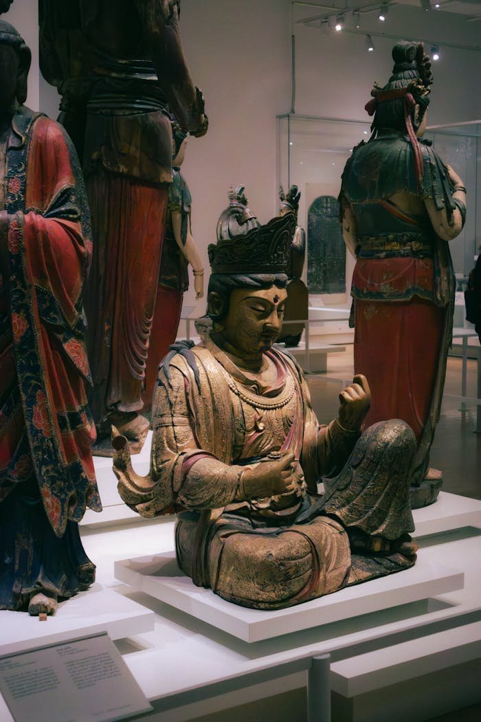 about-01 Intricate historic Buddha sculpture on display in a Toronto museum, showcasing Chinese cultural art.