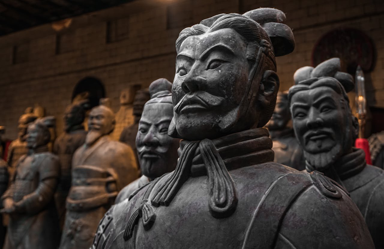 gallery-3 Close-up of terracotta warriors in Xi'an, capturing historical artistry and detail.